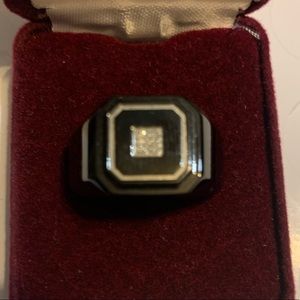 Men’s black onyx ring with CZ stones in the middle.